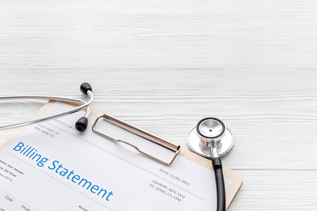 A billing statement with a stethoscope on a clipboard.
