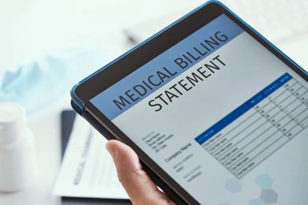 A person holding a tablet displaying a Medical Billing Statement.