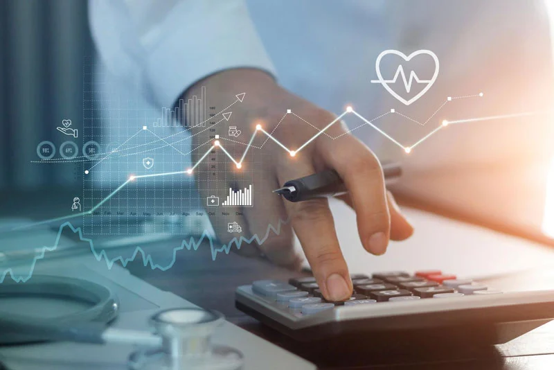 A-person-using-a-calculator-with-digital-health-and-financial-data-visualizations._1