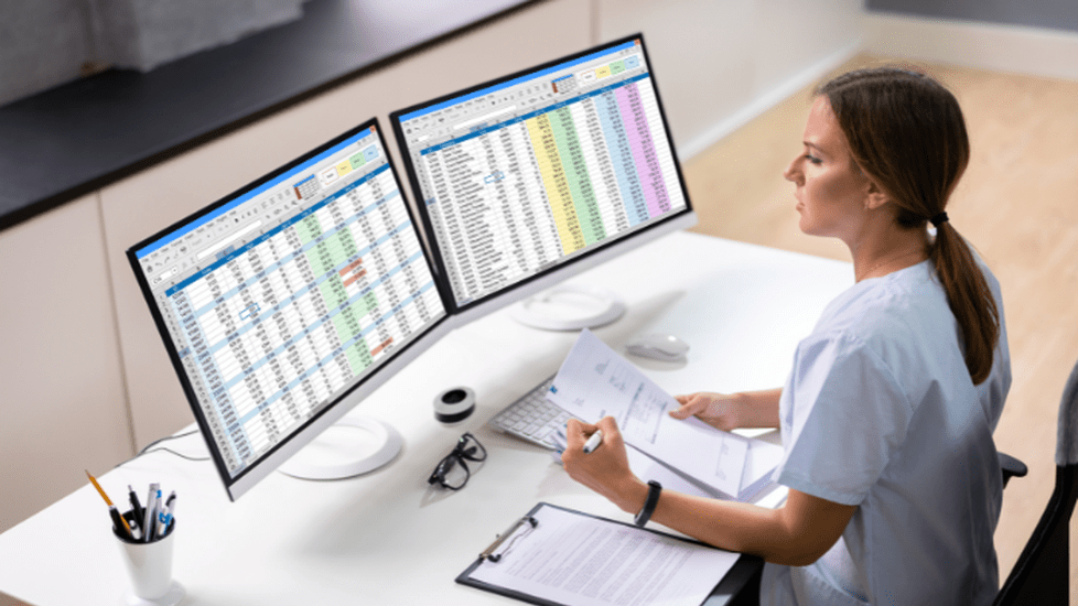 a female doctor sorting patients data