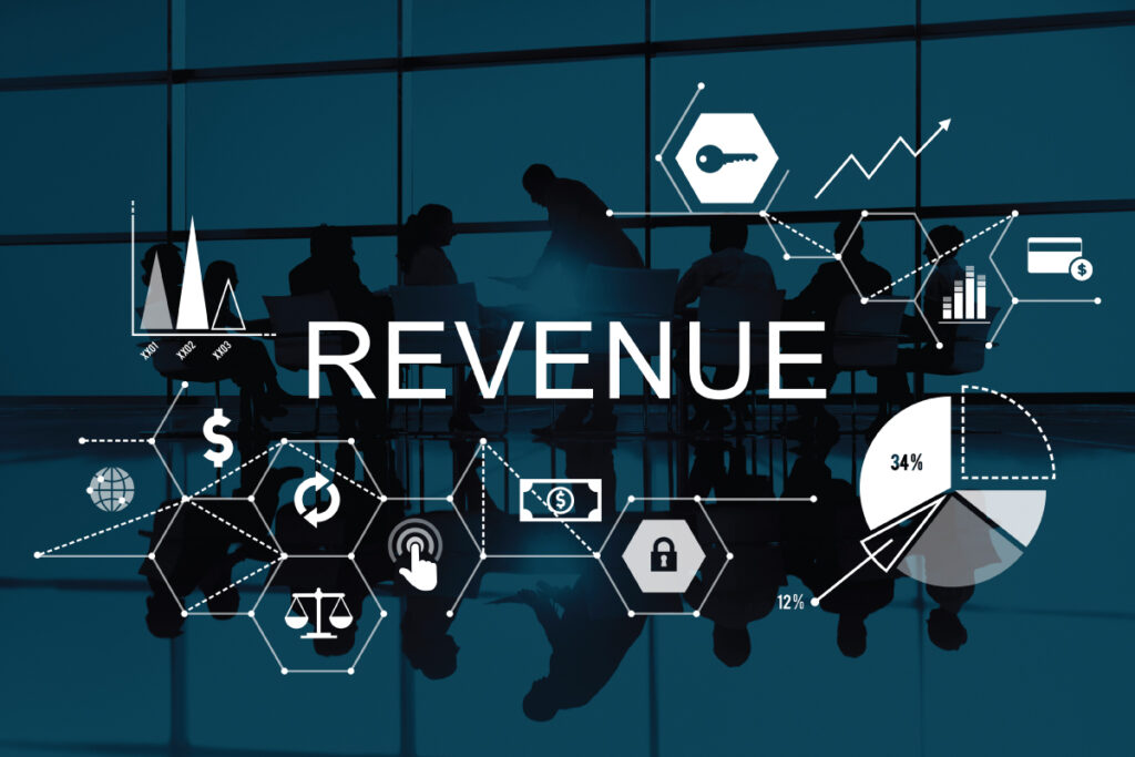 Business meeting with graphical data and revenue-related icons in the background.