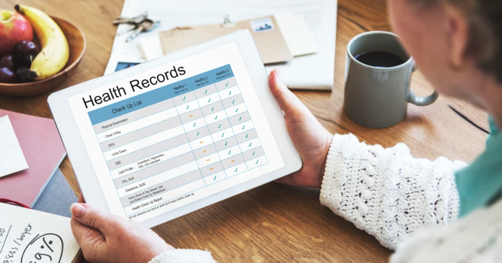 Healthcare professional reviewing electronic health records for medical billing