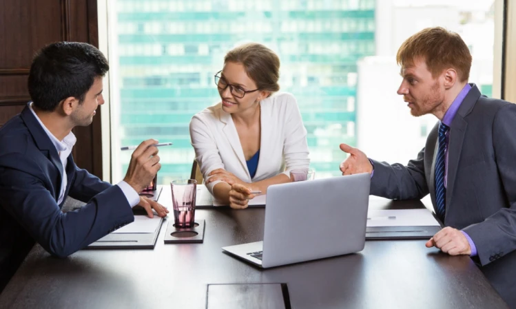 a female medical billing consultant talking to 2 males