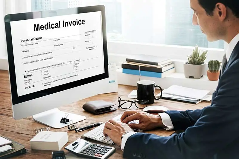 a-medical-biller-adding-information-to-medical-invoice (1)