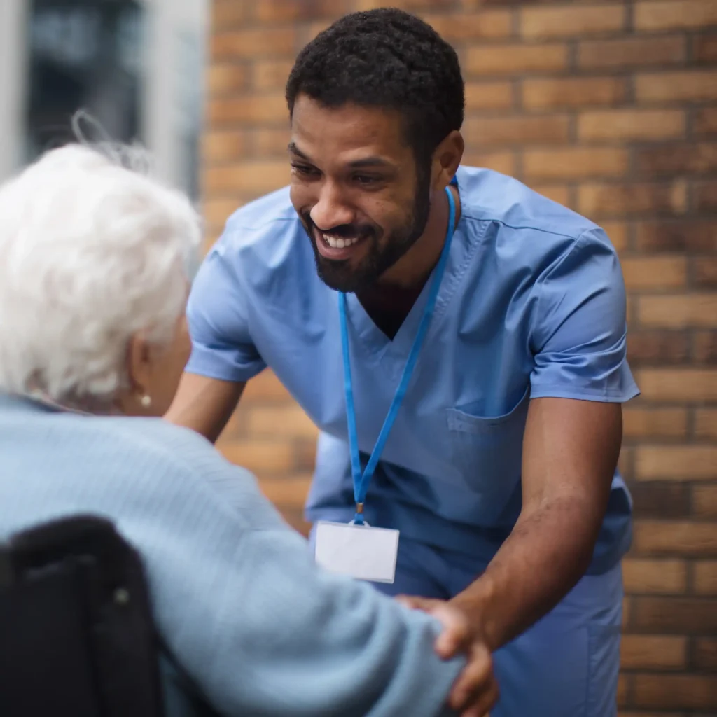 Healthcare professional interacting with elderly patient for medical services in New Jersey