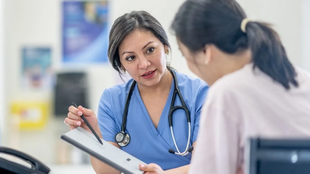 a doctor explaining EOB document to a patient